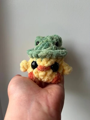 Mini chick in a frog hat