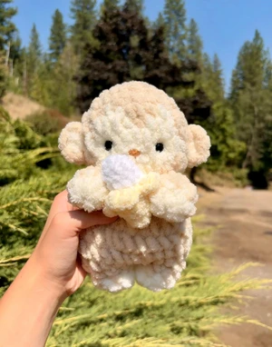 Baby Monkey holding Banana