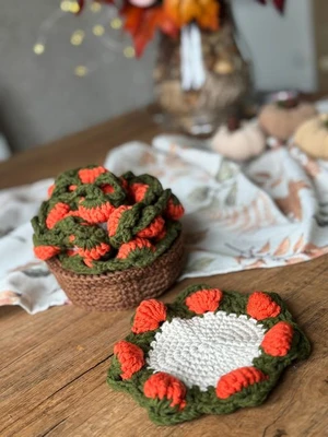 Crochet pumpkin coasters in the basket