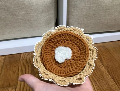 Crochet coaster set looks like a pumpkin pie